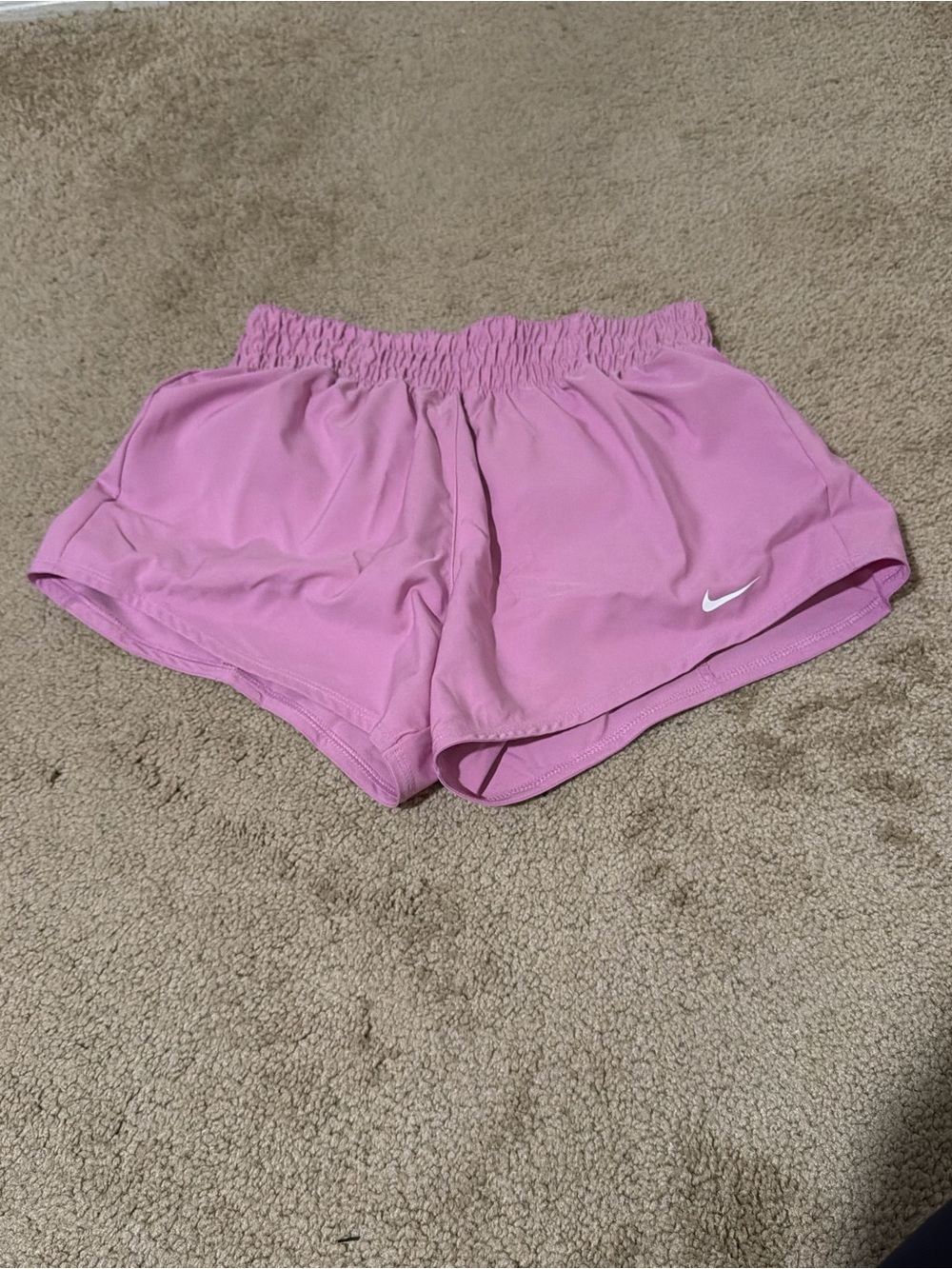 Nike Women’s Pink Athletic Shorts with White Swoosh